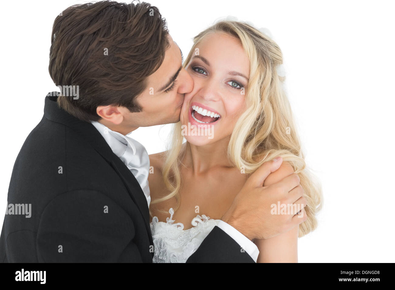 Bello sposo baciare la moglie sulla sua guancia Foto Stock