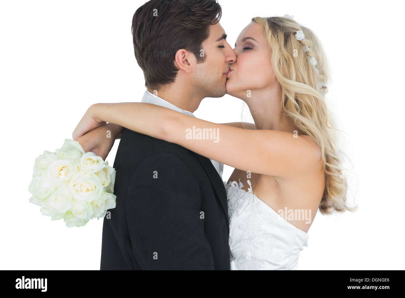 Bella Sposa abbracciando e baciando il marito Foto Stock