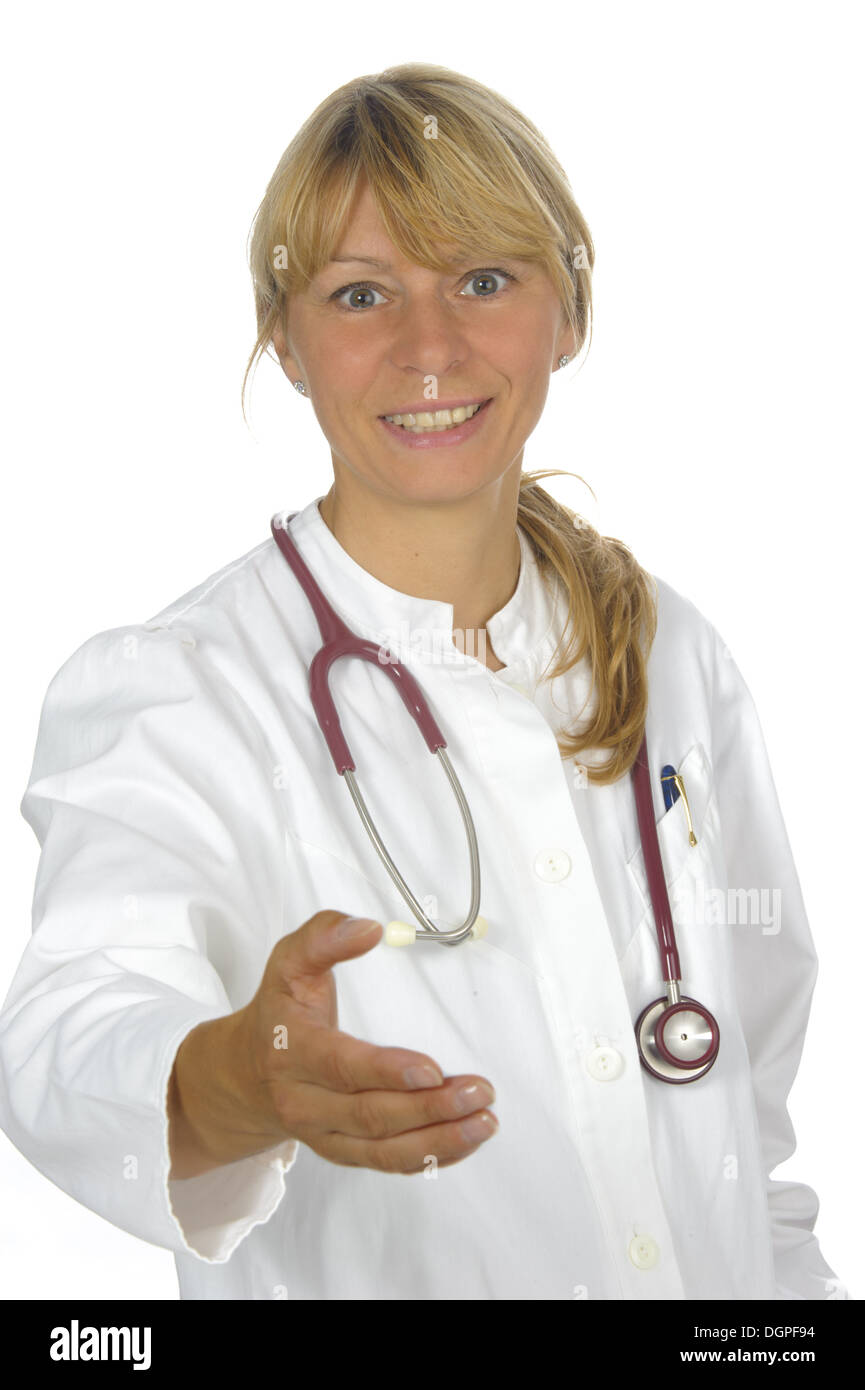 Medico donna dà la mano Foto Stock