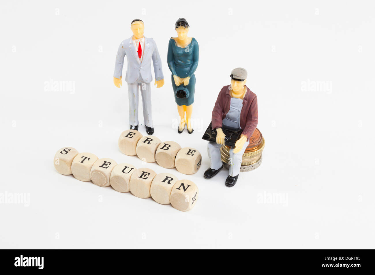 Le figure in miniatura, lettera cubi formanti le parole 'Erbe' e 'Steuern', tedesco per "eredità" e "imposte", immagine simbolica per Foto Stock