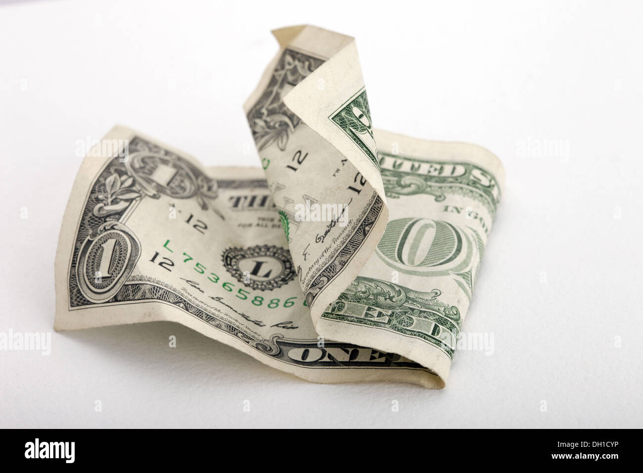 American accartocciata un dollaro nota su sfondo bianco Foto Stock