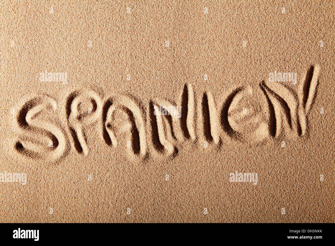 La scrittura nella sabbia 'SPANIEN" o "dolore" Foto Stock