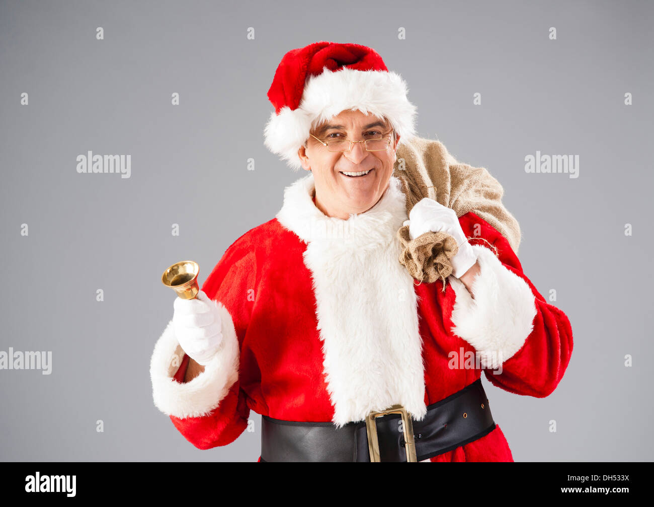 Babbo Natale con un sacco e di una campana Foto Stock