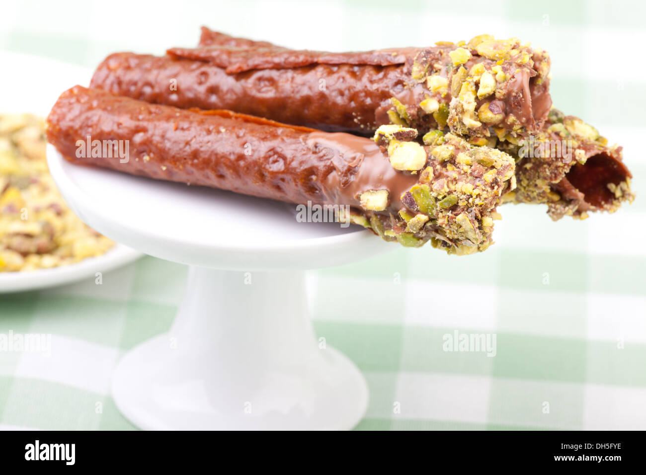 Il brandy scatta sul cupcake stand Foto Stock