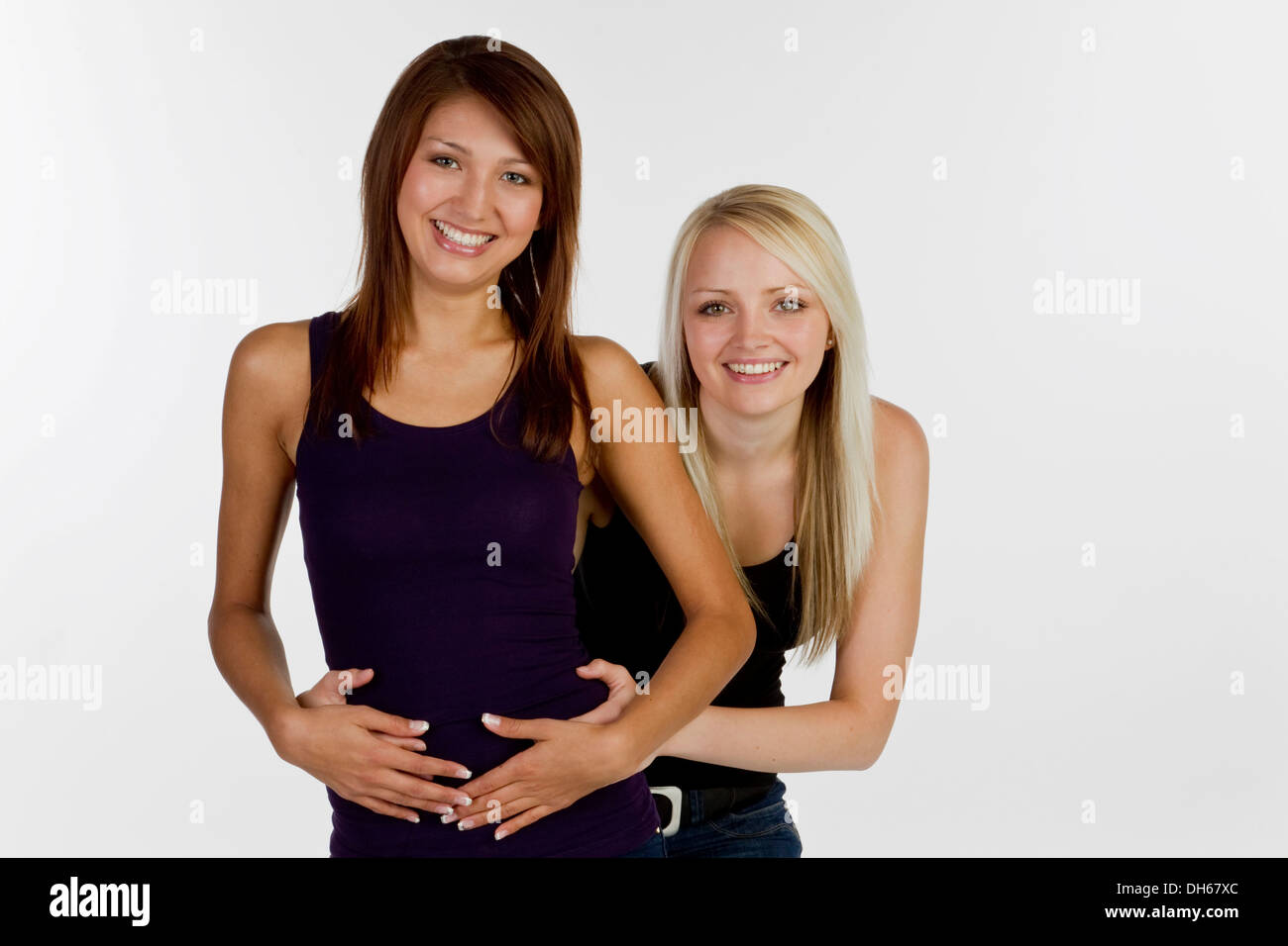 Sorridente due giovani donne Foto Stock