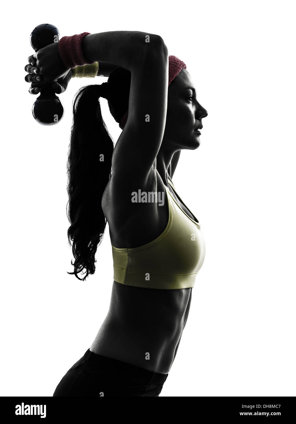Una donna esercizio di allenamento fitness in silhouette su sfondo bianco Foto Stock