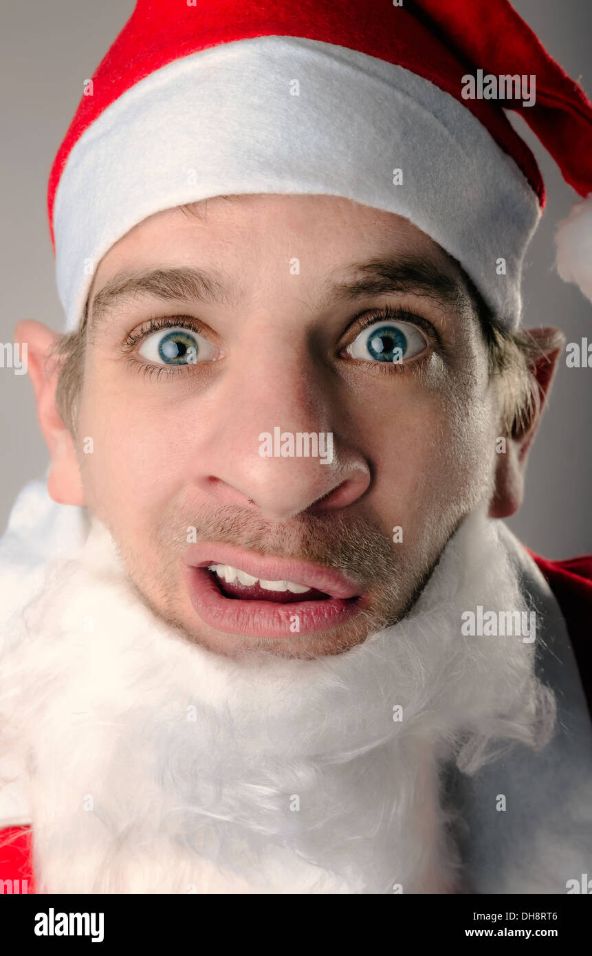 Un babbo natale cercando ironicamente e scettici Foto Stock