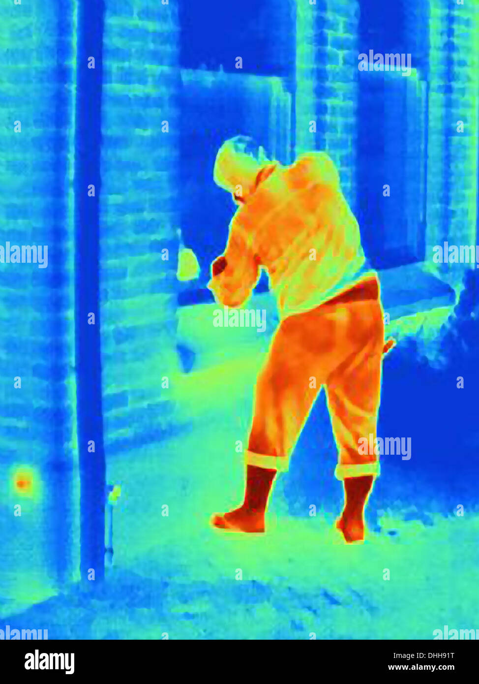 Fotografia termica di un ladro la rottura in una casa Foto Stock