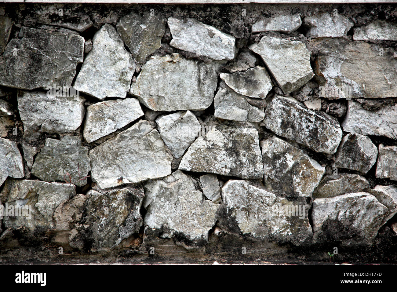 L'immagine di sfondo case di parete è realizzata ​​of old stone. Foto Stock
