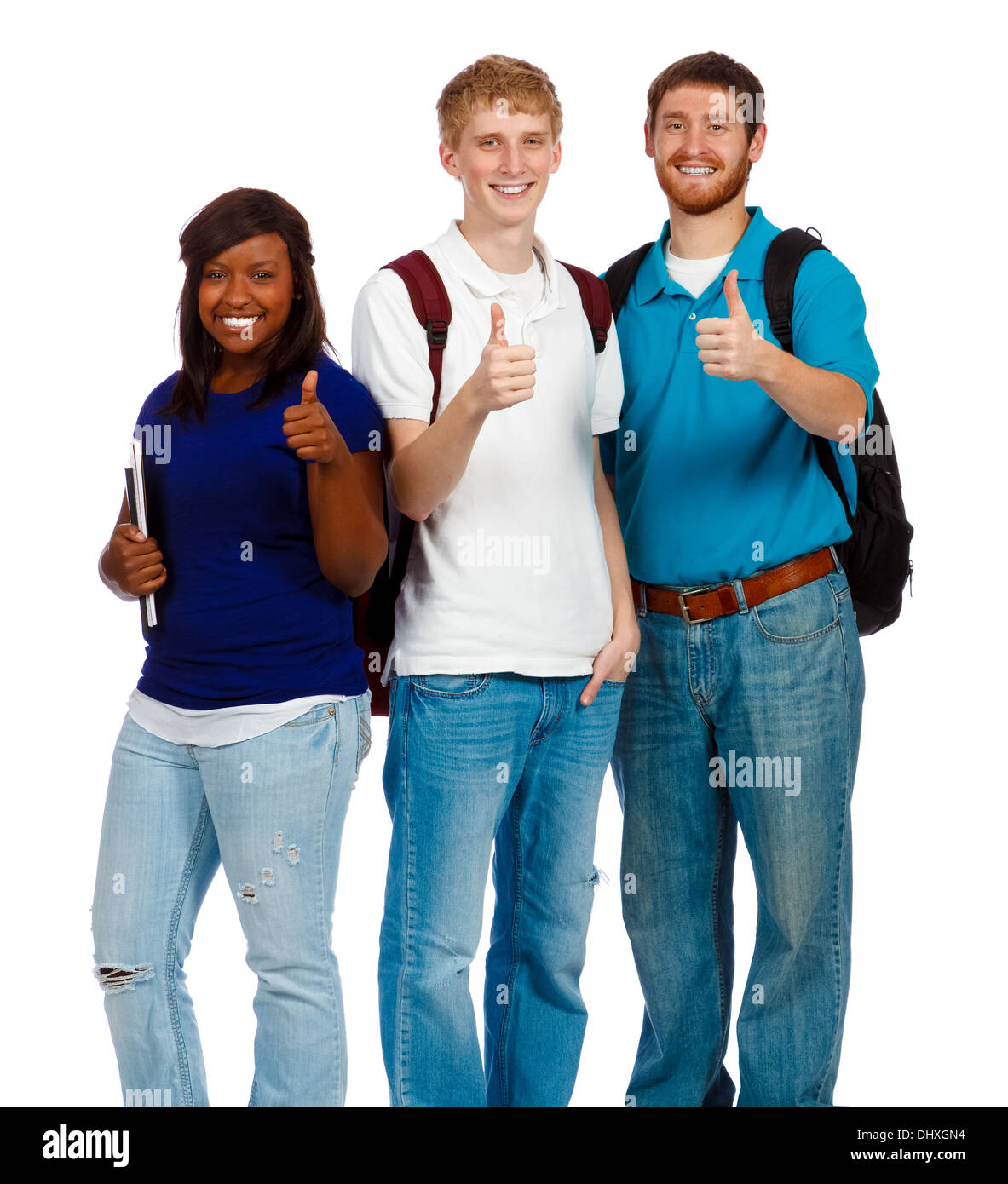 Un gruppo di tre studenti del college o gli amici con il pollice in alto segno Foto Stock