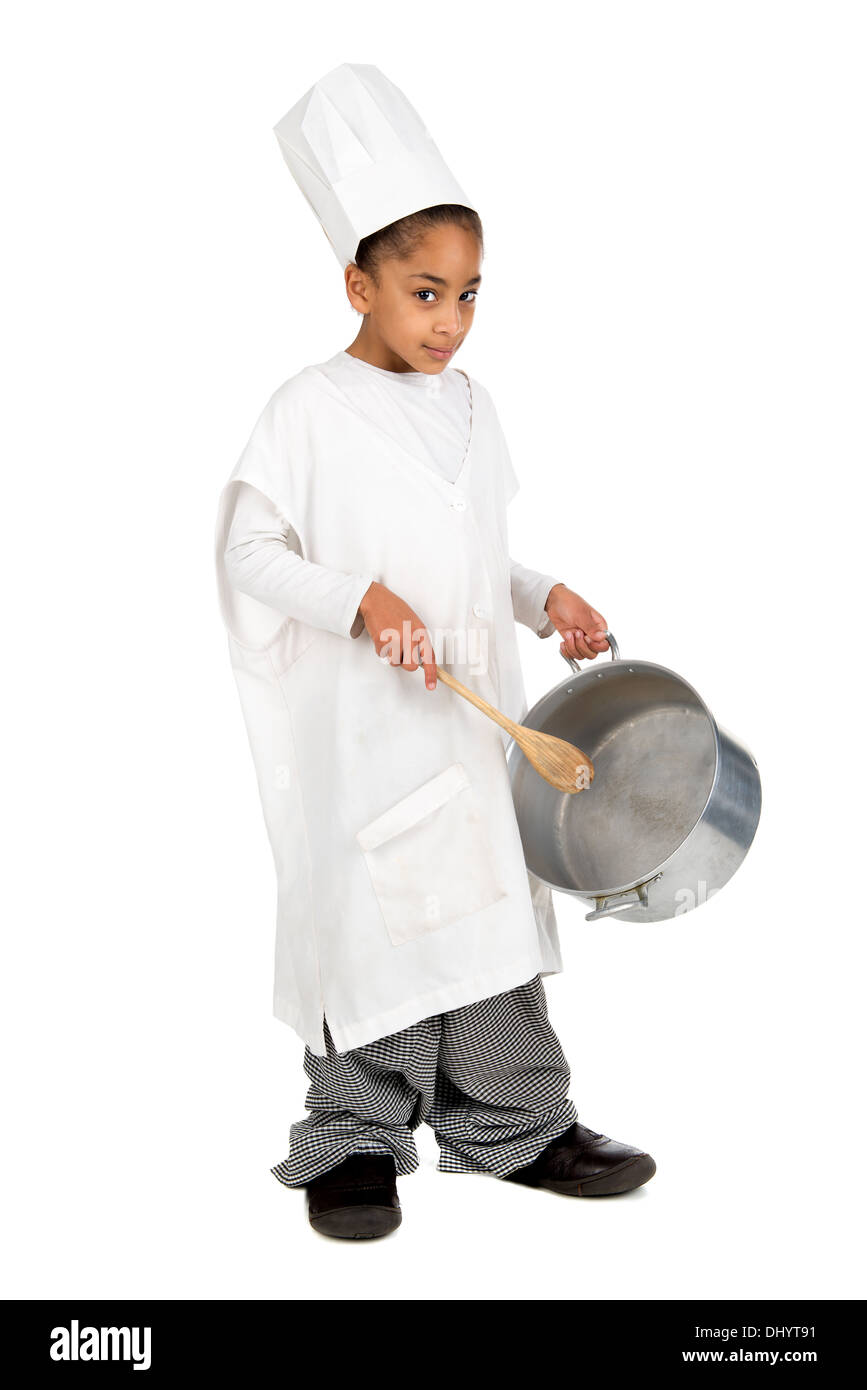Ragazza giovane chef in costume con un cucchiaio di legno e pan Foto Stock