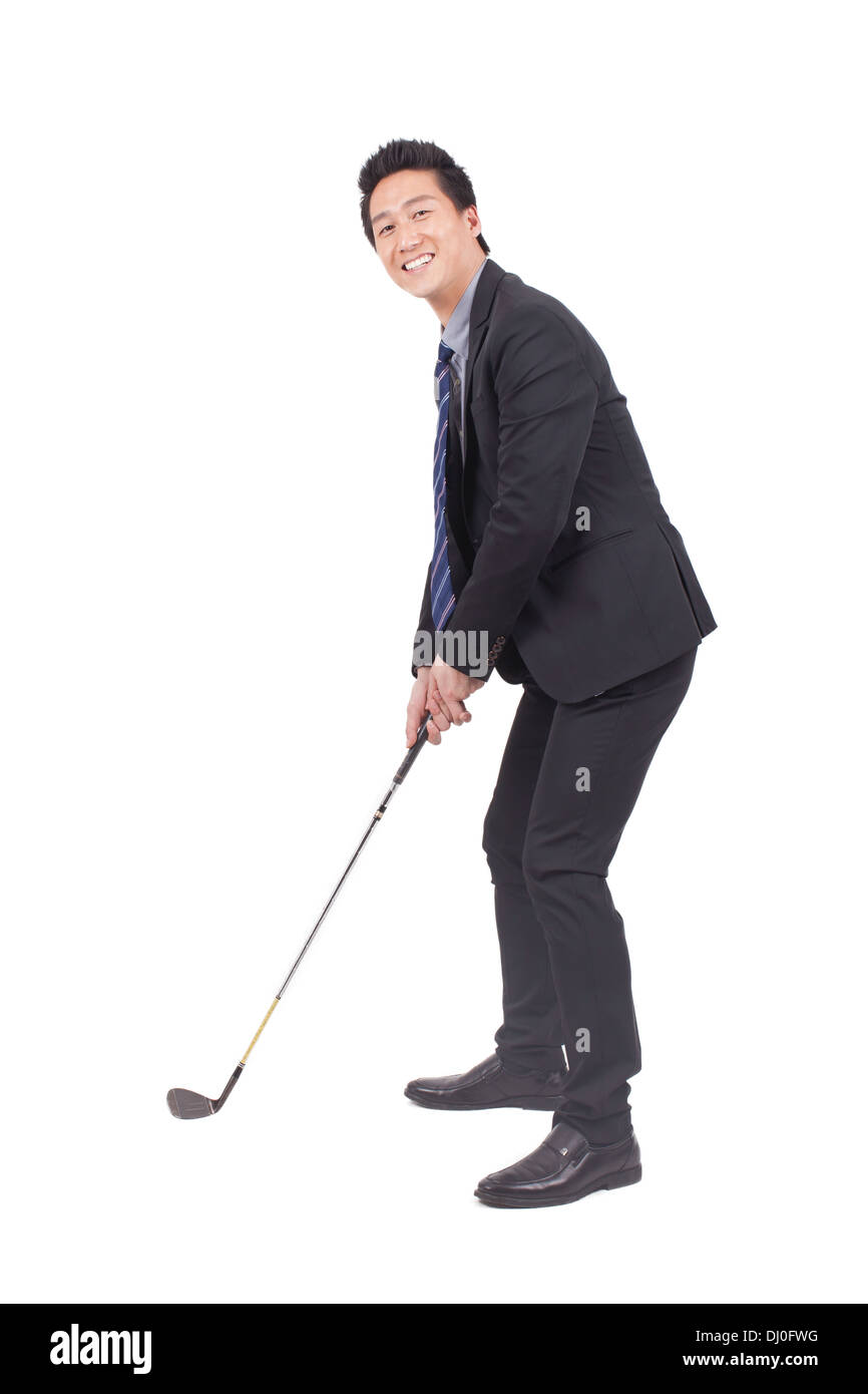 Business man holding golf swing e sorridente alla fotocamera Foto Stock