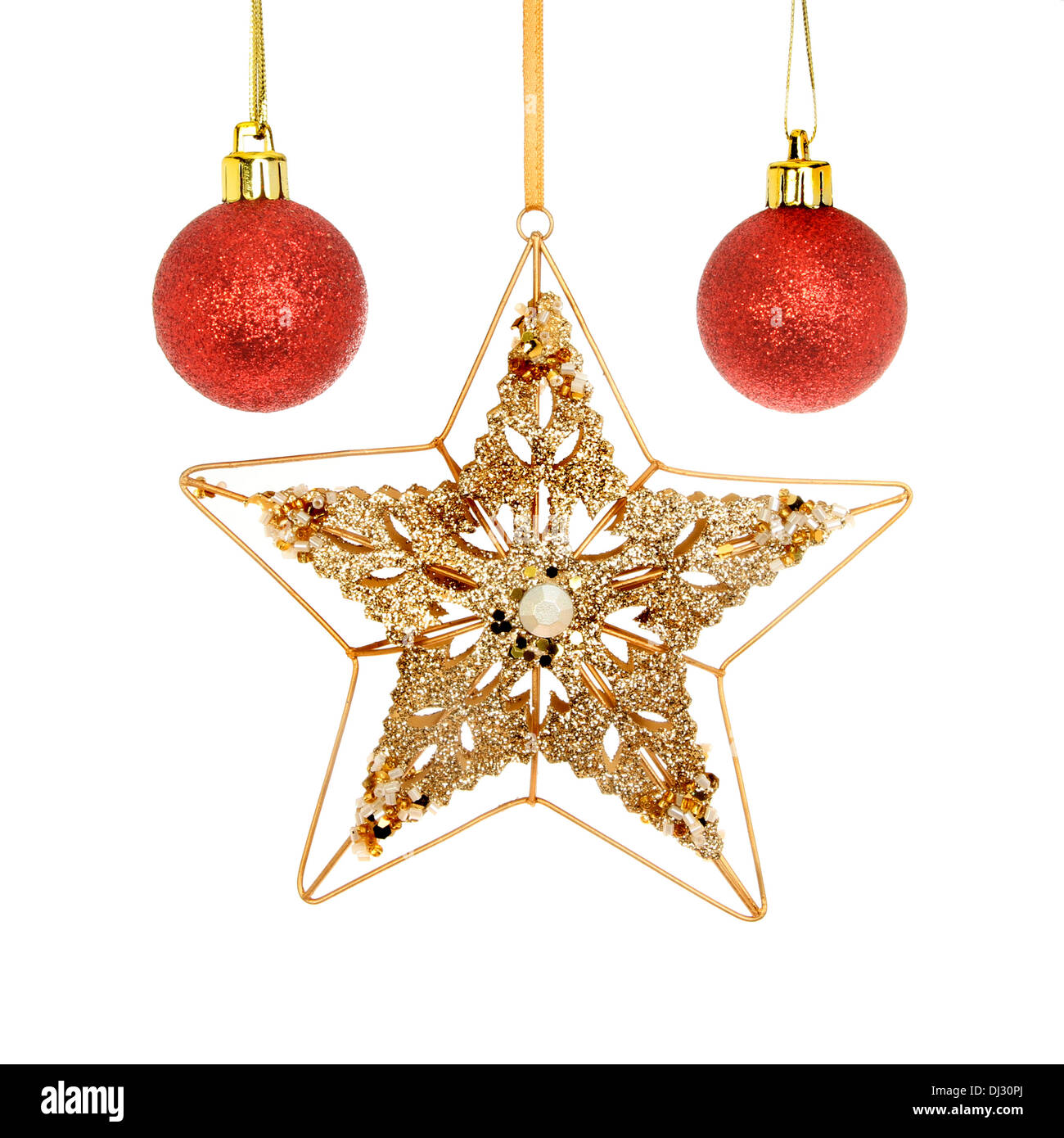 Oro, glitter e jeweled stella di Natale con red baubles isolata contro bianco Foto Stock