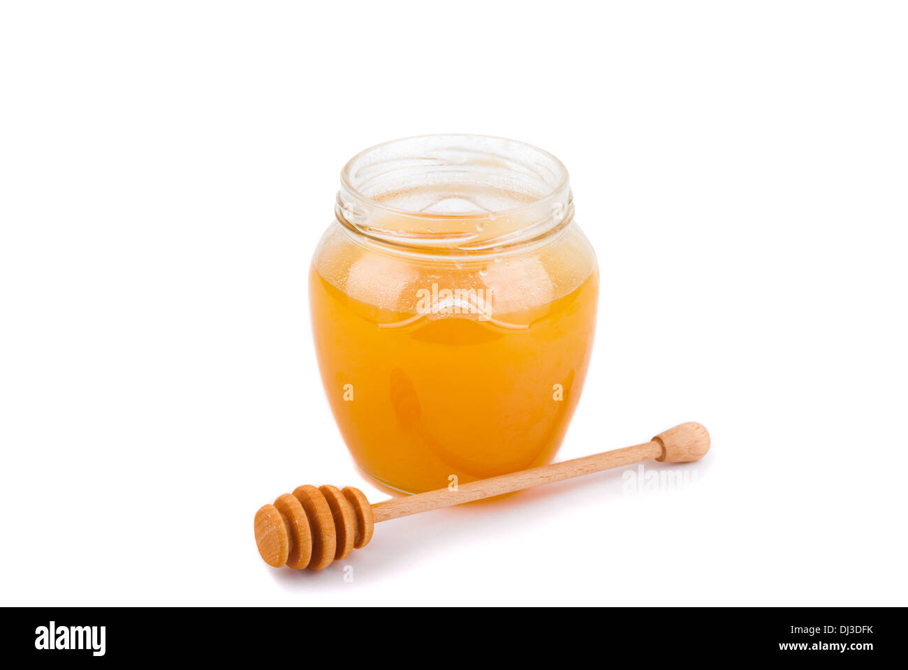 Il miele in un vasetto di vetro. Foto Stock