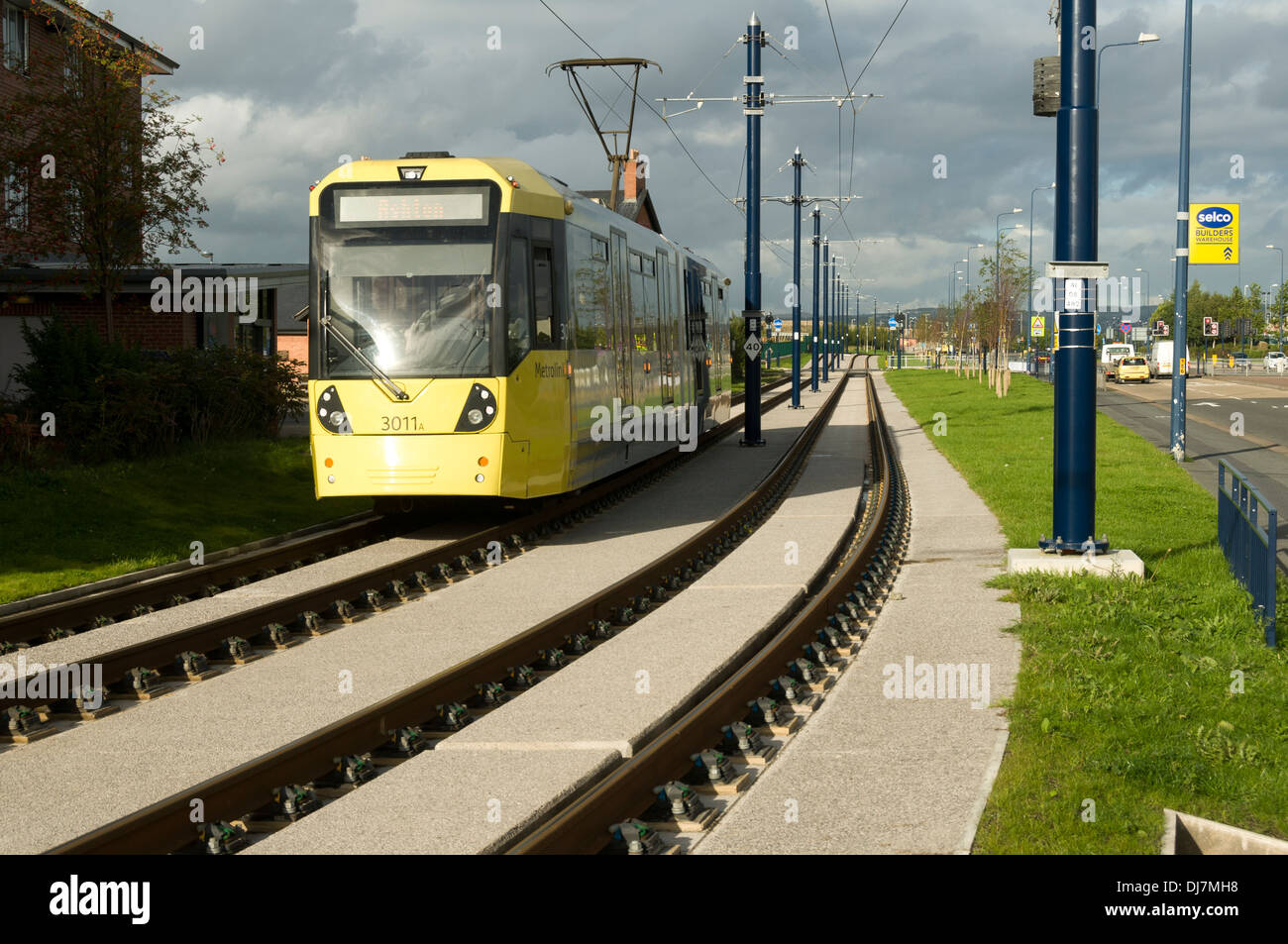 Tram Metrolink sul Signore Sheldon modo, sulla East Manchester Linea, Ashton Under Lyne, Tameside, Manchester, Inghilterra, Regno Unito Foto Stock
