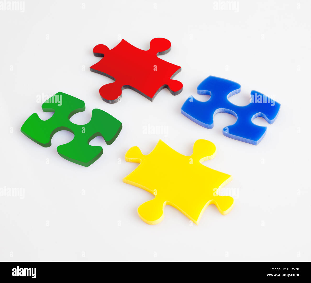 Quattro pezzi di un puzzle di colore metafora soluzione, business concetto immagini Foto Stock