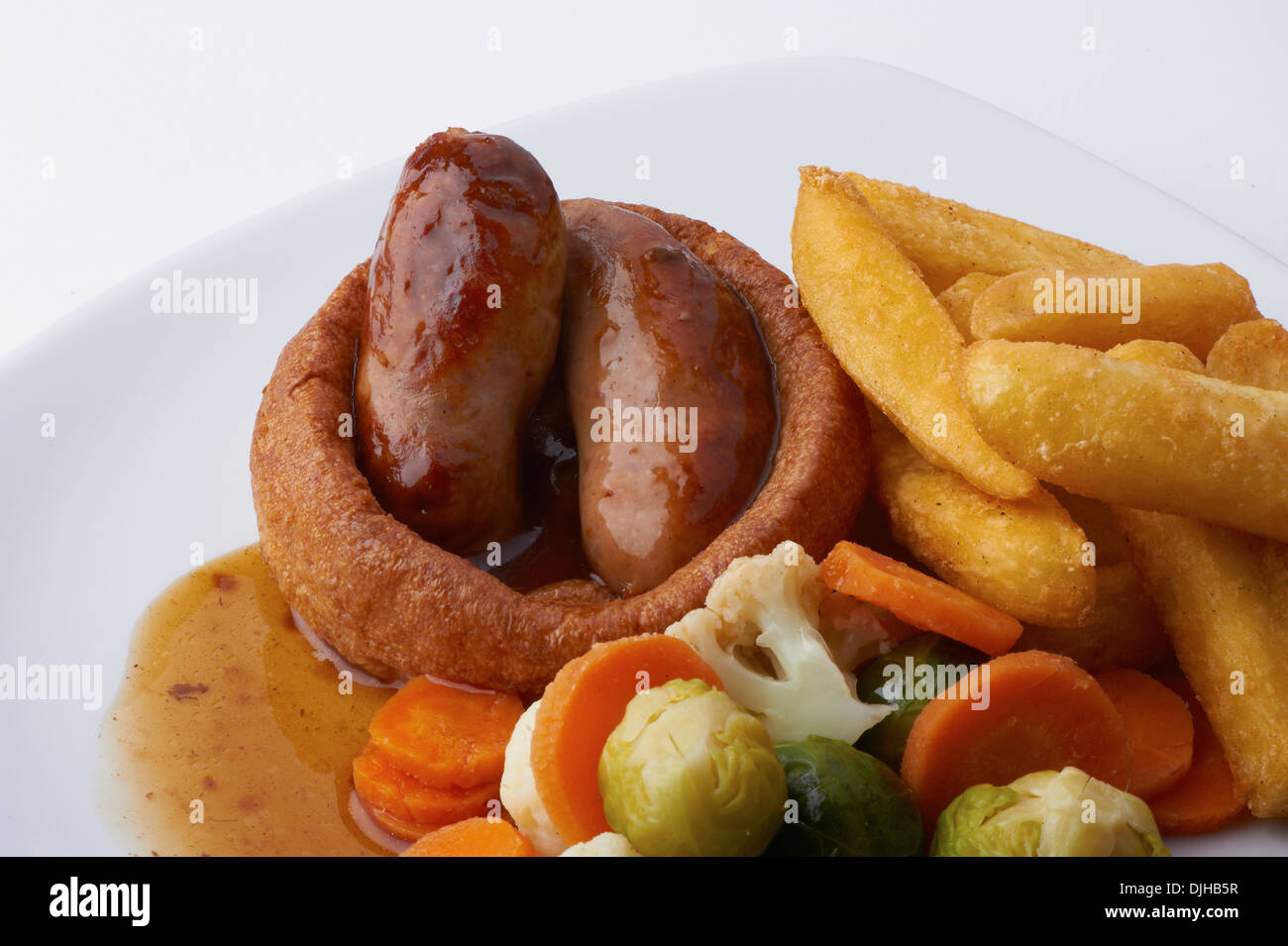 Toad nel foro, salsicce in pastella,chips, verdura,gravy,i germogli Foto Stock