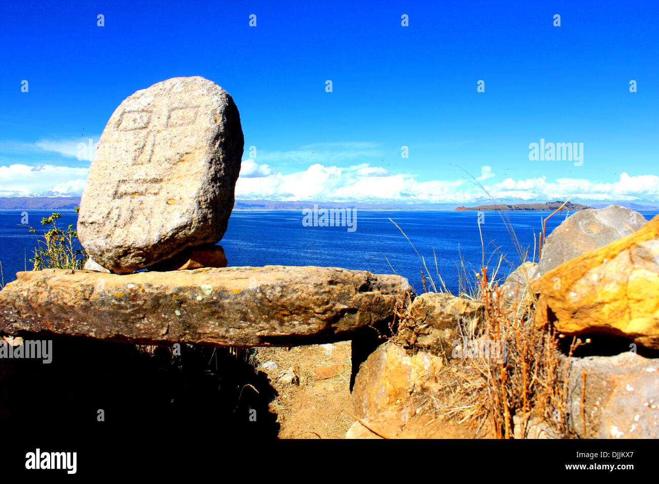 Volto scolpito nella pietra in Isla del Sol, il lago Titicaca, Bolivia Foto Stock