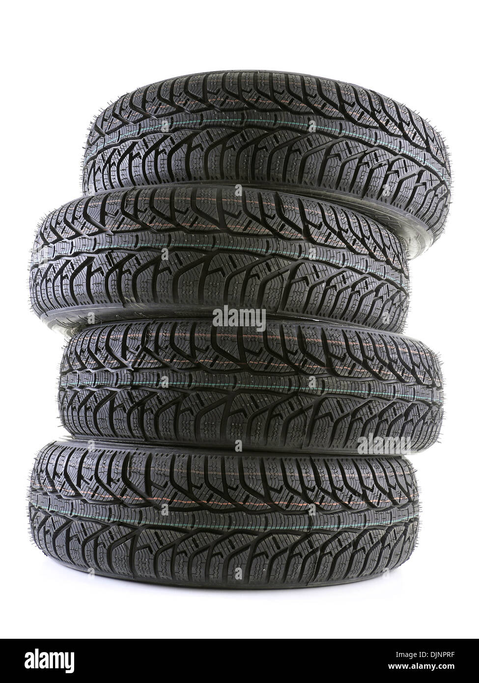 Pila di quattro inverno pneumatici per auto girato su bianco Foto Stock