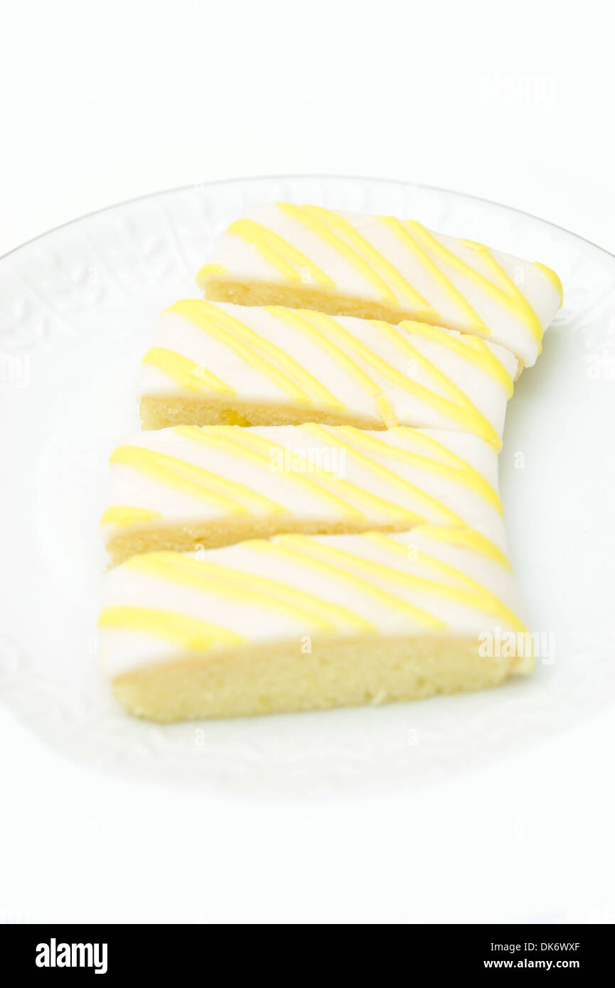 Torte per teatime - fette di limone su una piastra Foto Stock