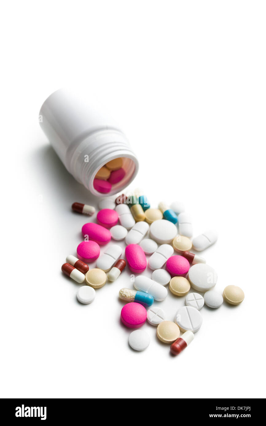 Eventuali fuoriuscite di pillole colorate dal flacone di medico Foto Stock