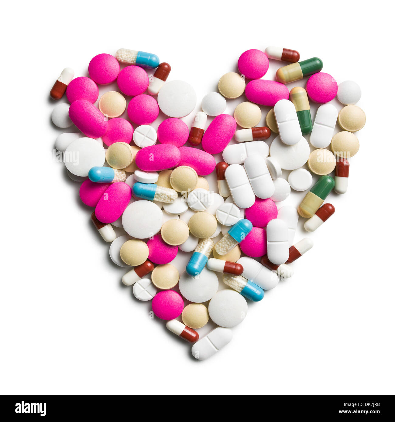Vista dall'alto di pillole colorate a forma di cuore Foto Stock