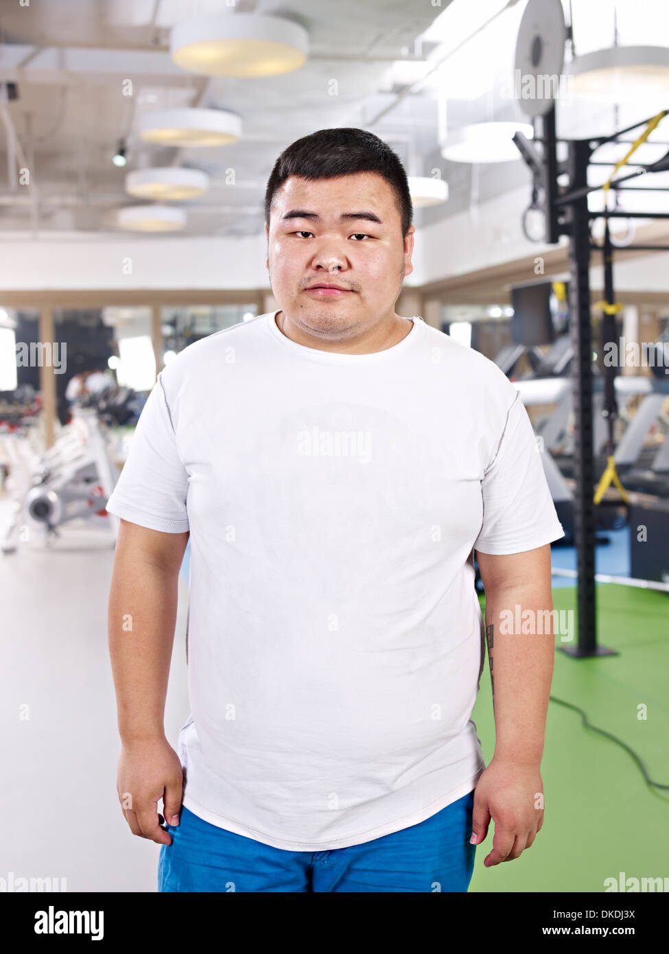 Il sovrappeso Uomo asiatico Foto Stock