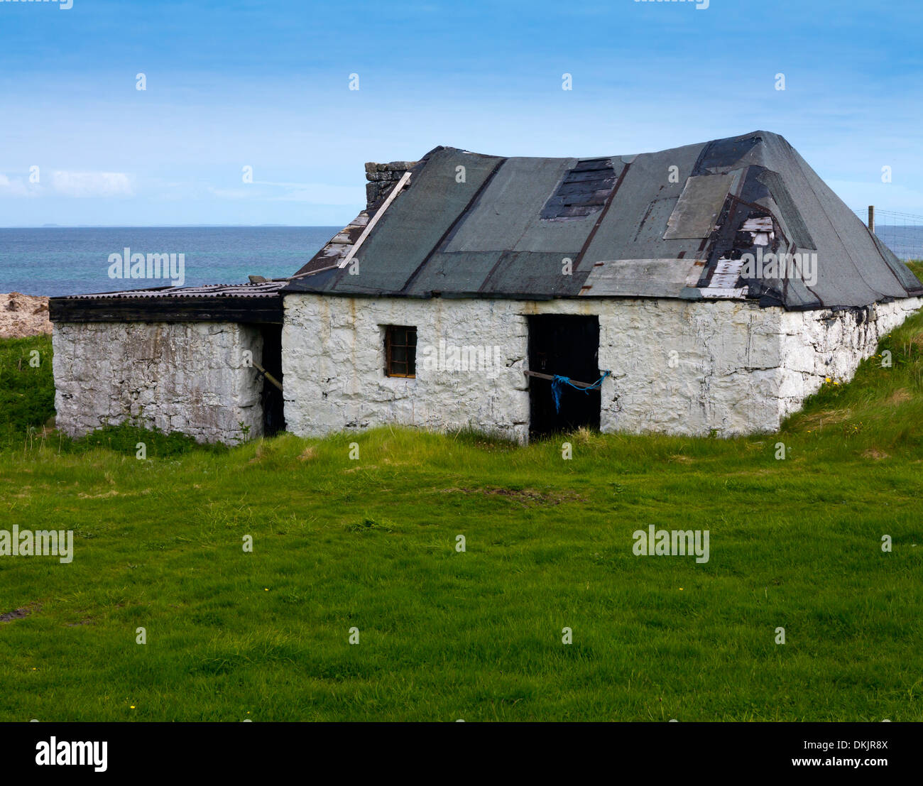 Deserta crofters tradizionale cottage a Mannal Isle of Tiree nelle Ebridi Interne Argyll and Bute Scozia UK Foto Stock