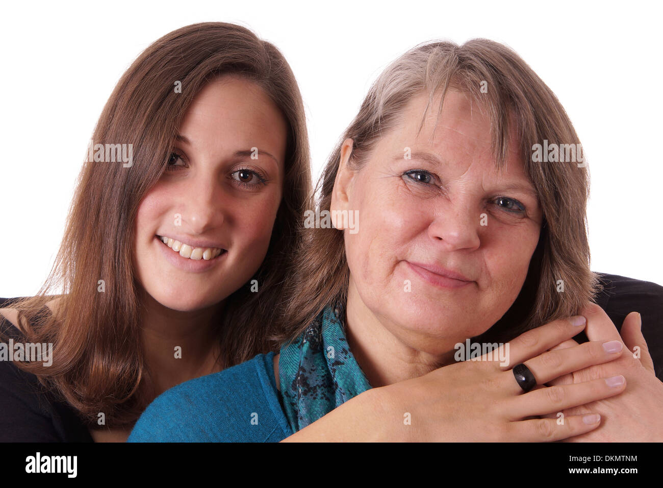 Figlia abbracciando la madre Foto Stock