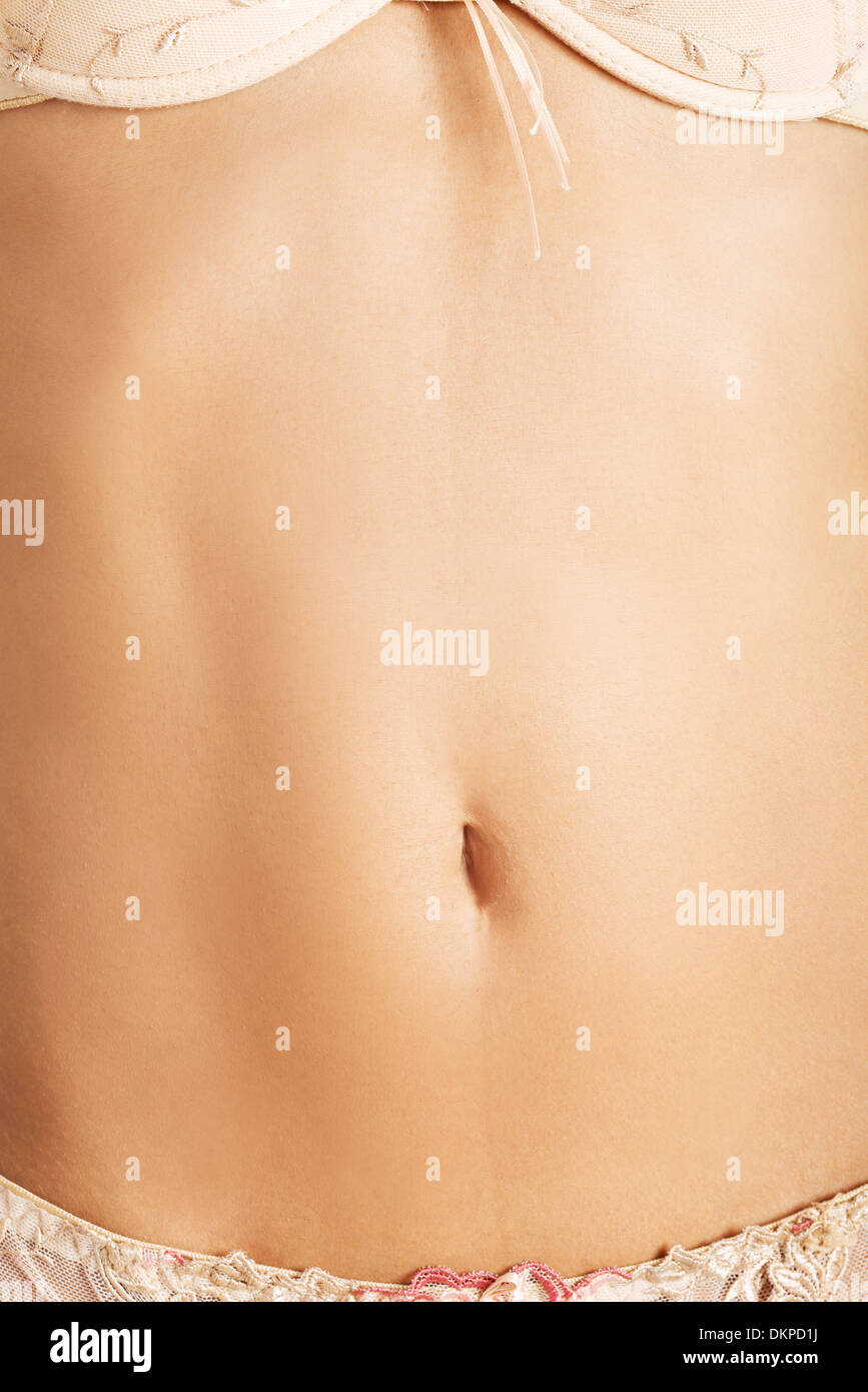 Montare e sottile per la giovane donna pancia Foto Stock