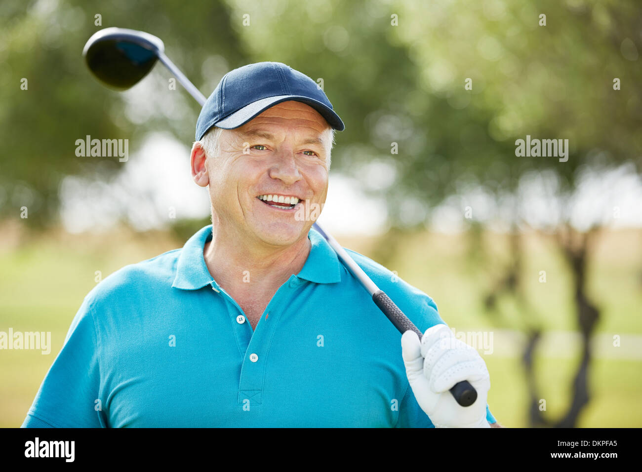 Senior man holding golf club Foto Stock