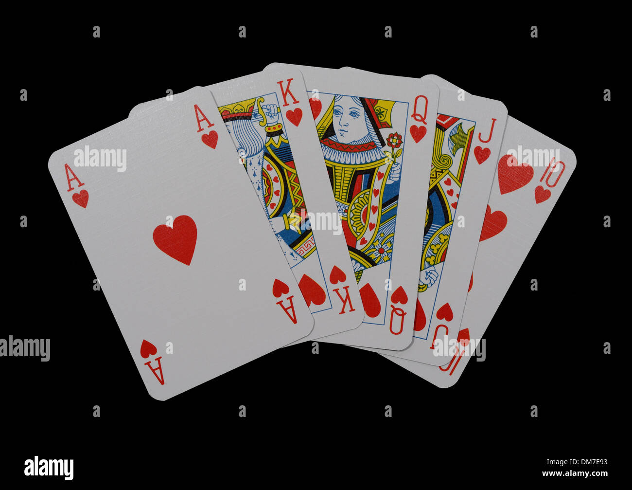 Una mano di carte da gioco che mostra un royal flush isolate su un sfondo per studio Foto Stock