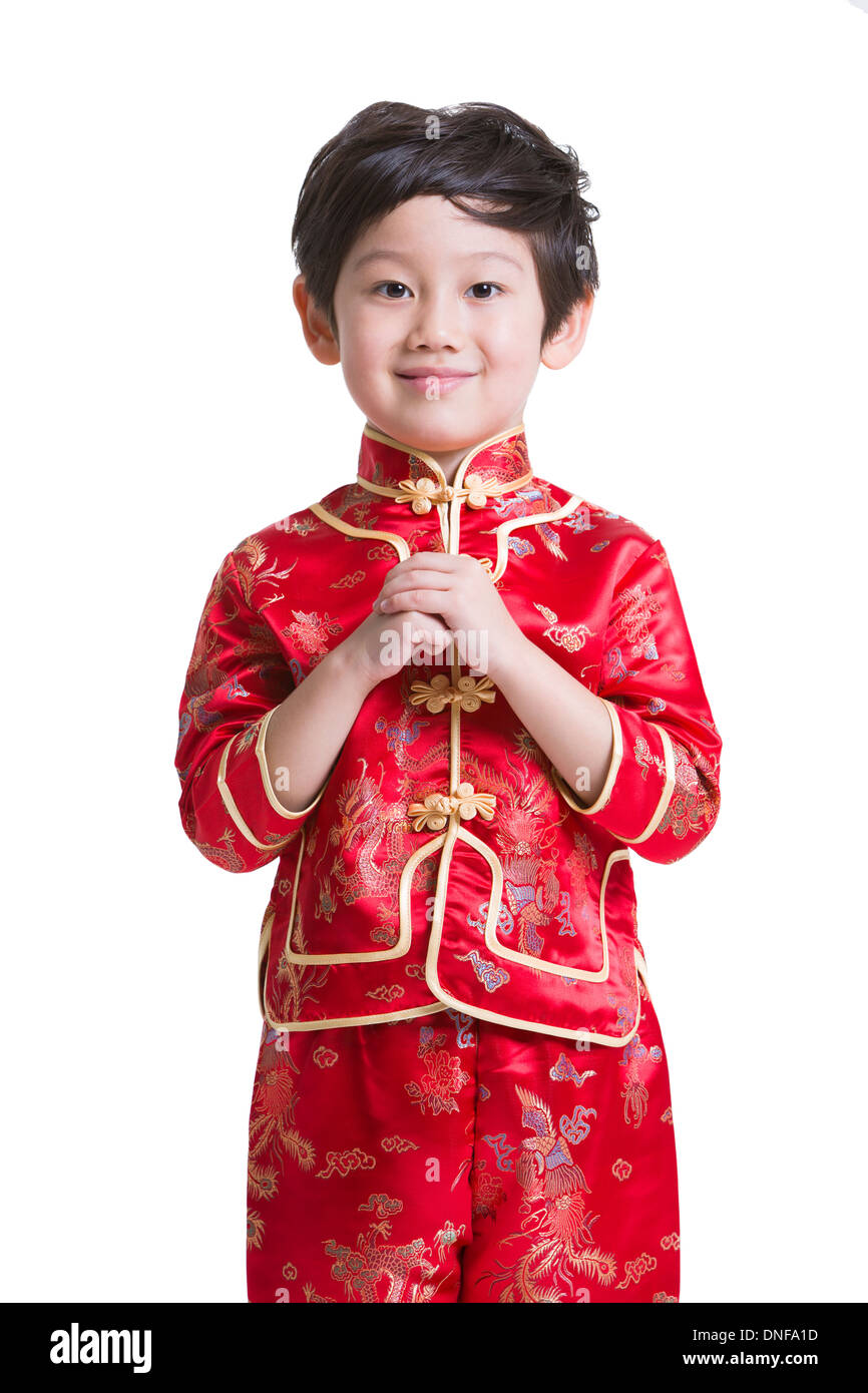 Carino boy in abbigliamento tradizionale saluto per il Capodanno cinese  Foto stock - Alamy