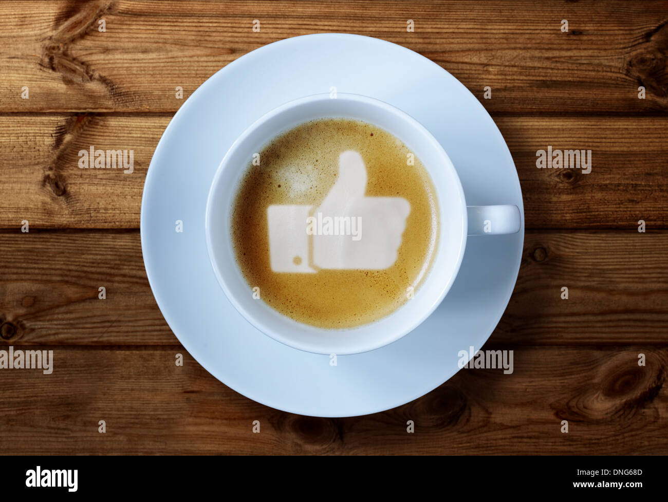 Pollice in alto segno nel caffè Foto Stock