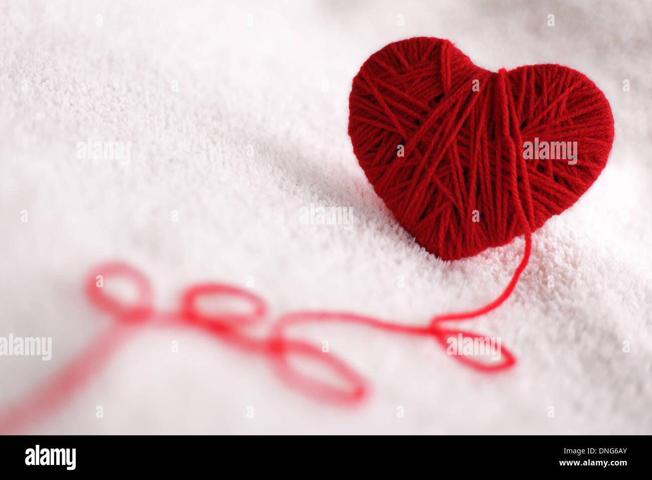 Filati di lana in forma di cuore simbolo Foto Stock