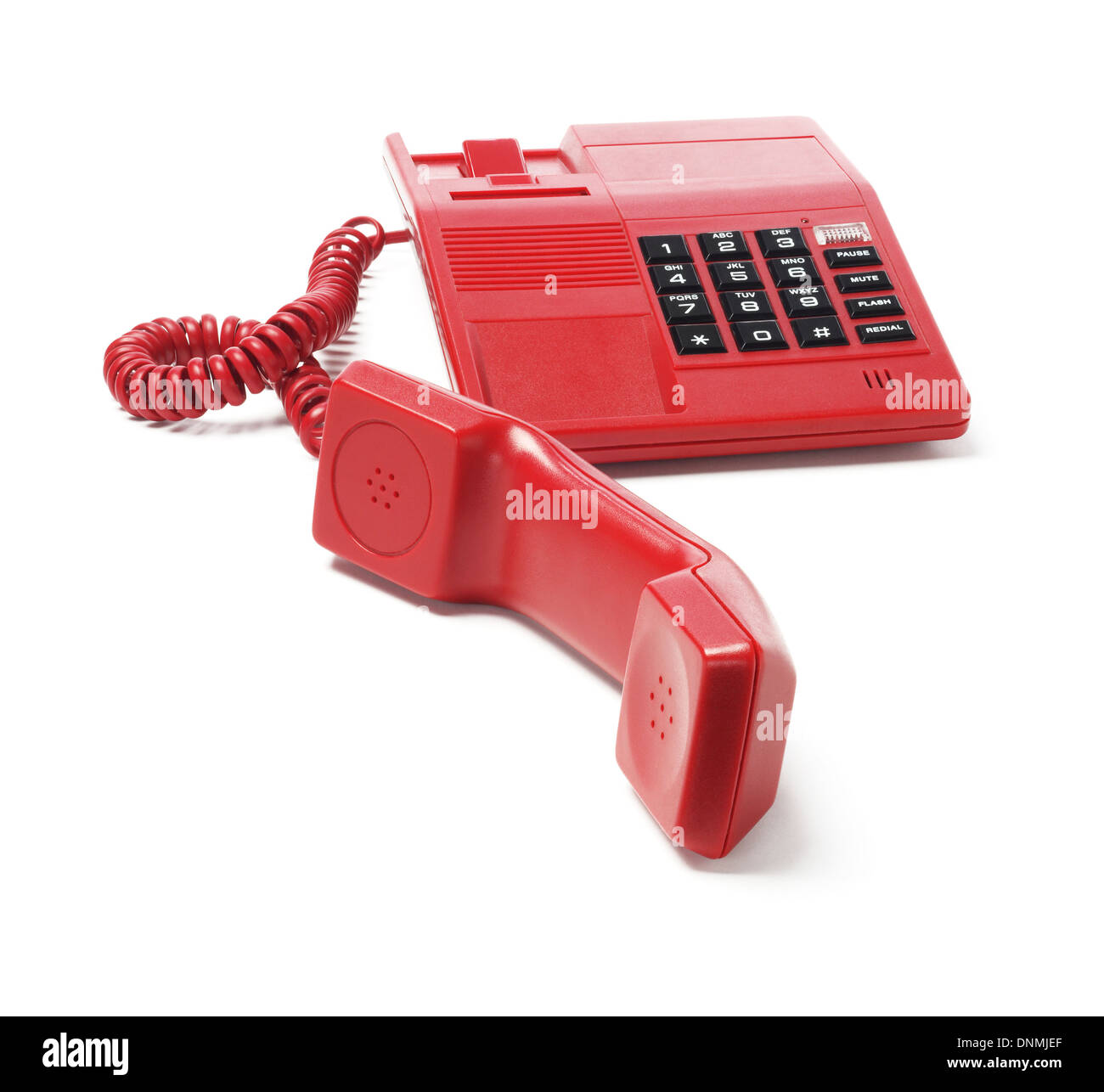 Telefono rosso su sfondo bianco Foto Stock