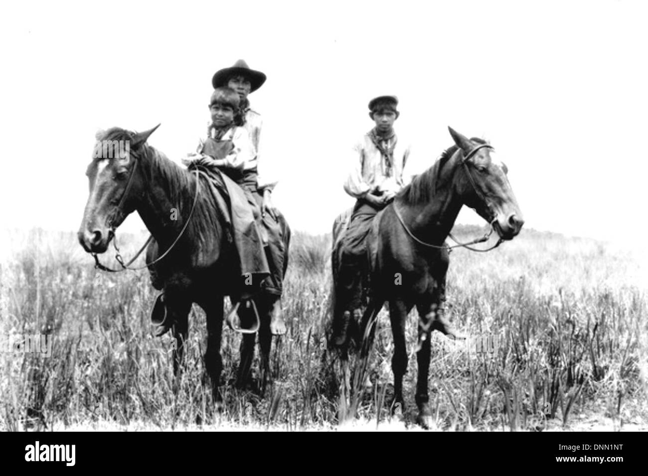 Unidentified Seminole uomini a cavallo: Indiana Prairie vicino al lago Okeechobee, Florida Foto Stock