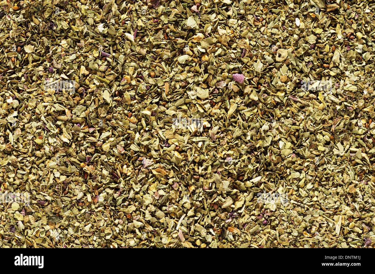 Macro Immagine di sfondo di basilico essiccato in scaglie herb Foto Stock