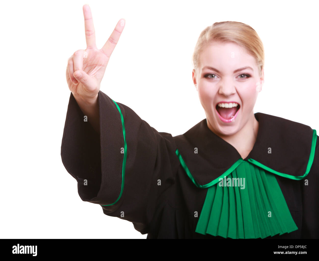 La legge o la Corte di giustizia. La donna avvocato avvocato in polacco nero abito verde facendo segno ok vittoria successo mano gesto isolato Foto Stock