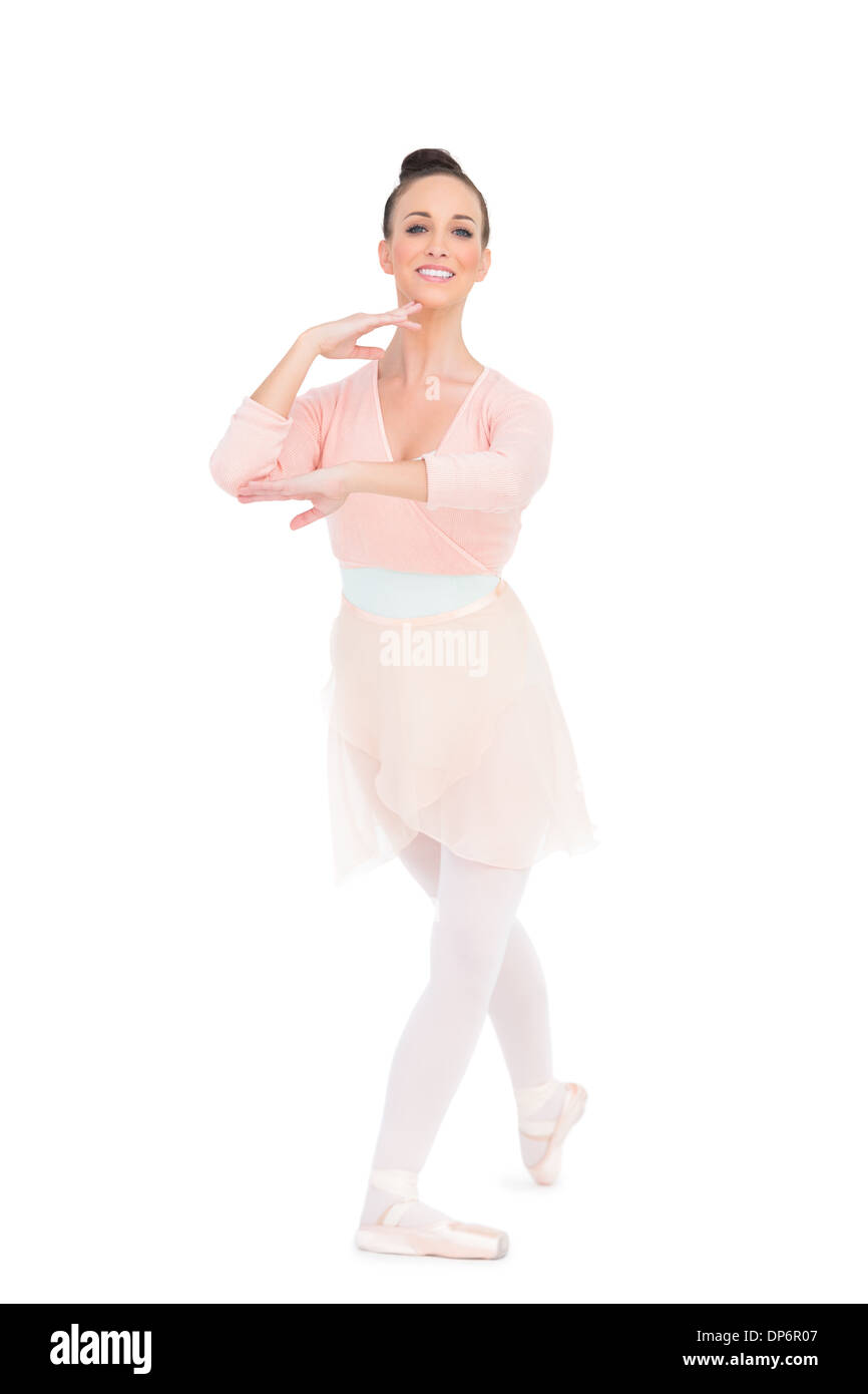 Allegro attraente ballerina in piedi in una posa Foto Stock