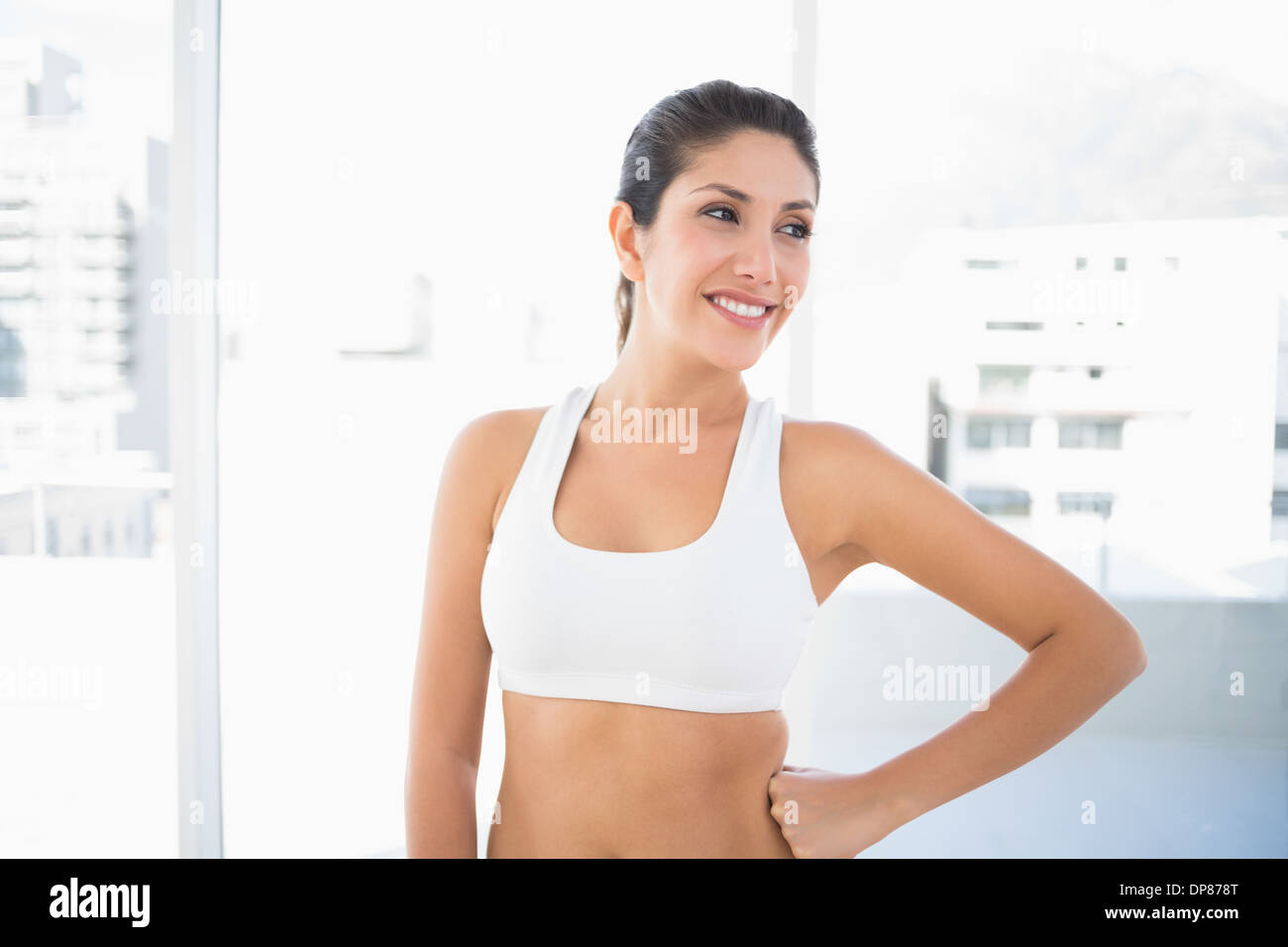 Montare donna felice in sportswear Foto Stock