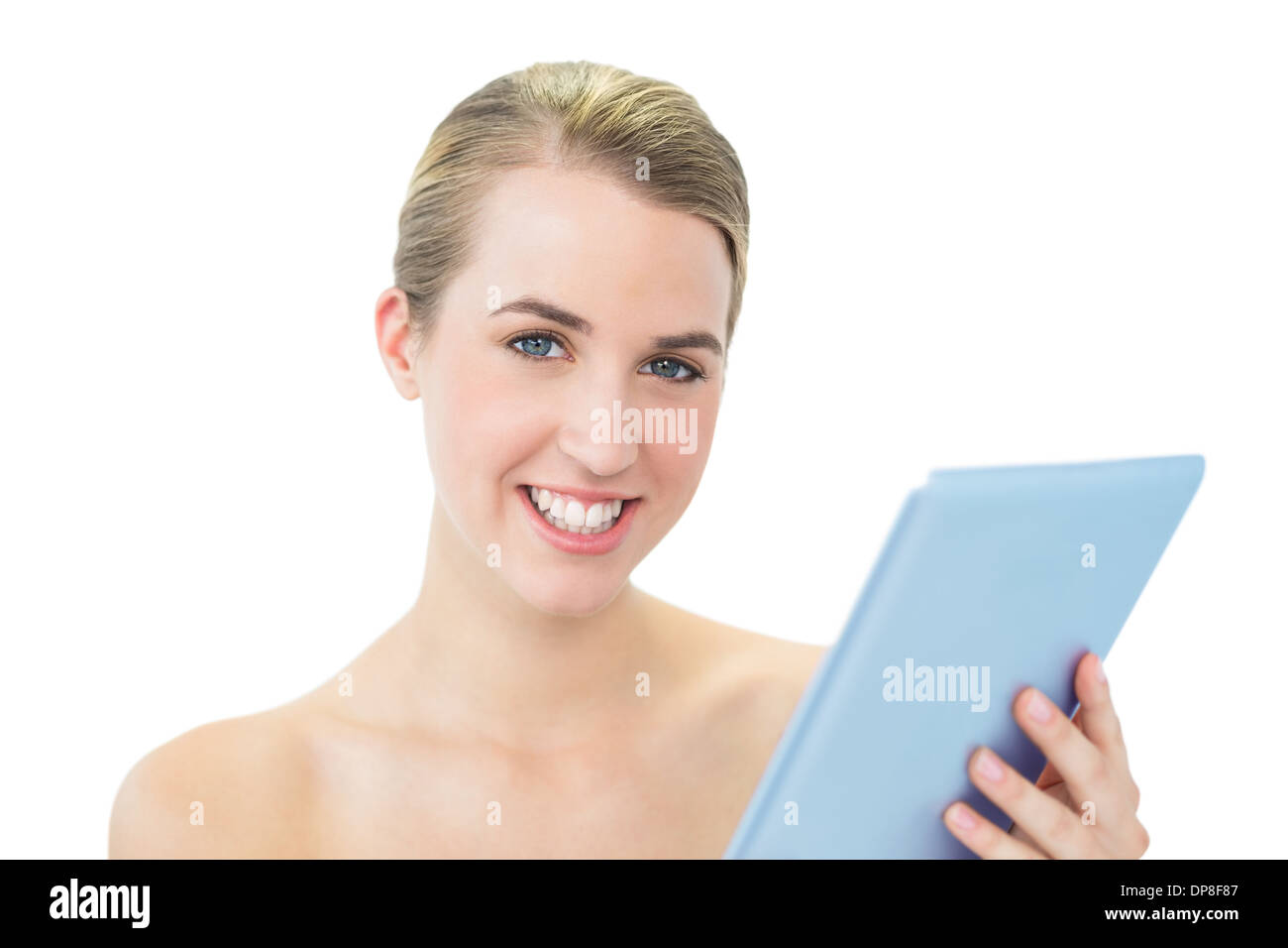 Sorridente bionda attraente utilizzando tablet pc Foto Stock