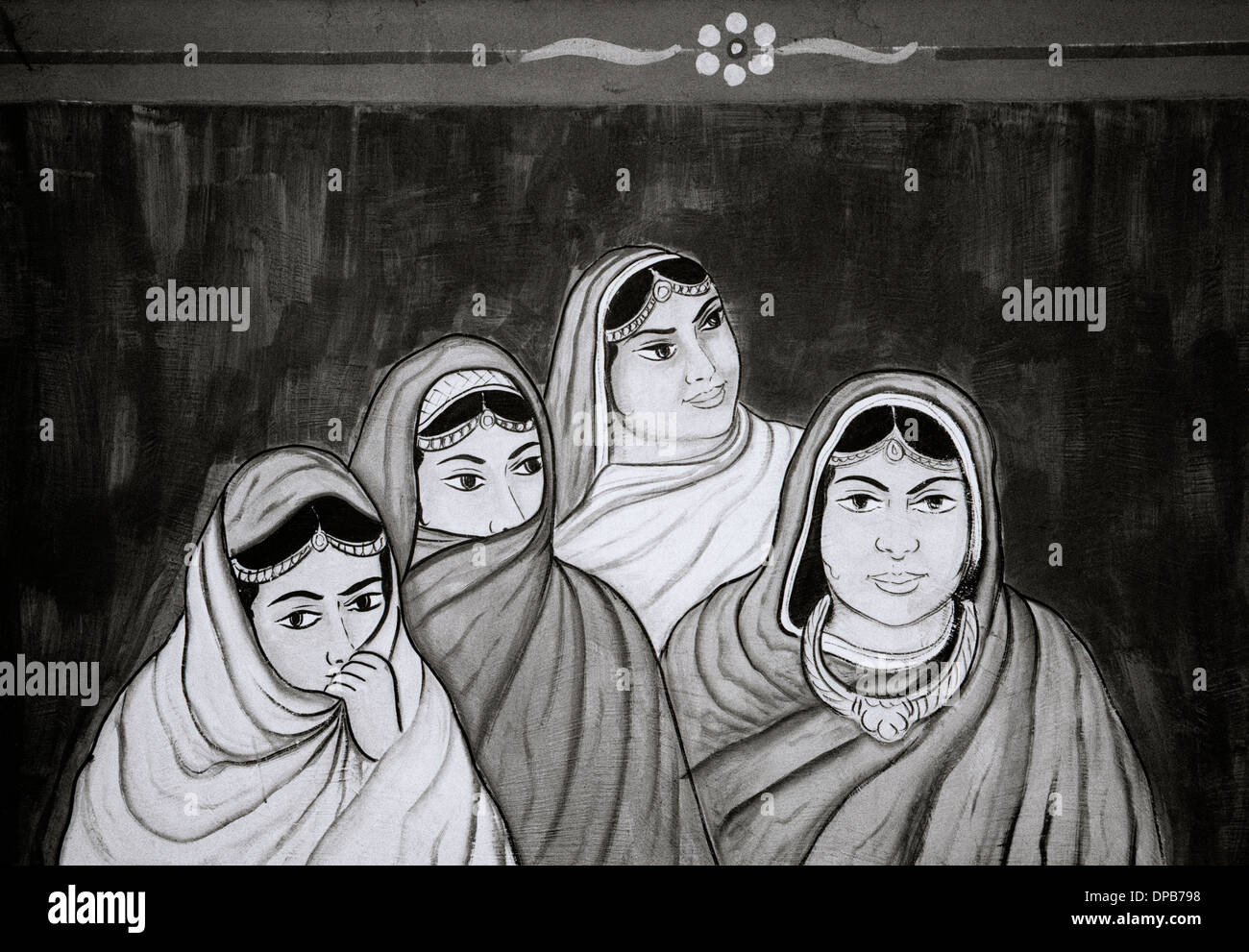 Arte di strada in Udaipur nel Rajasthan in India in Asia del Sud. Urban Graffiti donna donne musulmani islam musulmani cultura islamica velo persone Foto Stock