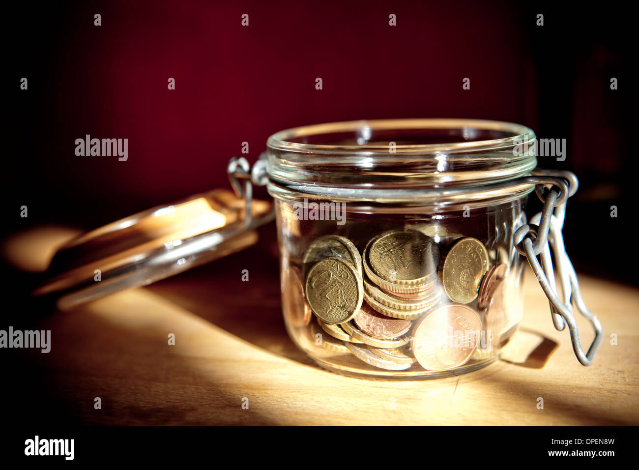 monete in un vaso Foto Stock