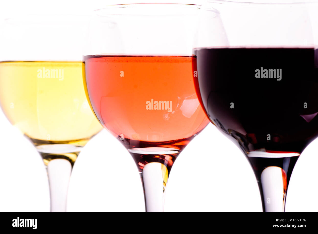 Tre diversi bicchieri di vino isolato su bianco Foto Stock