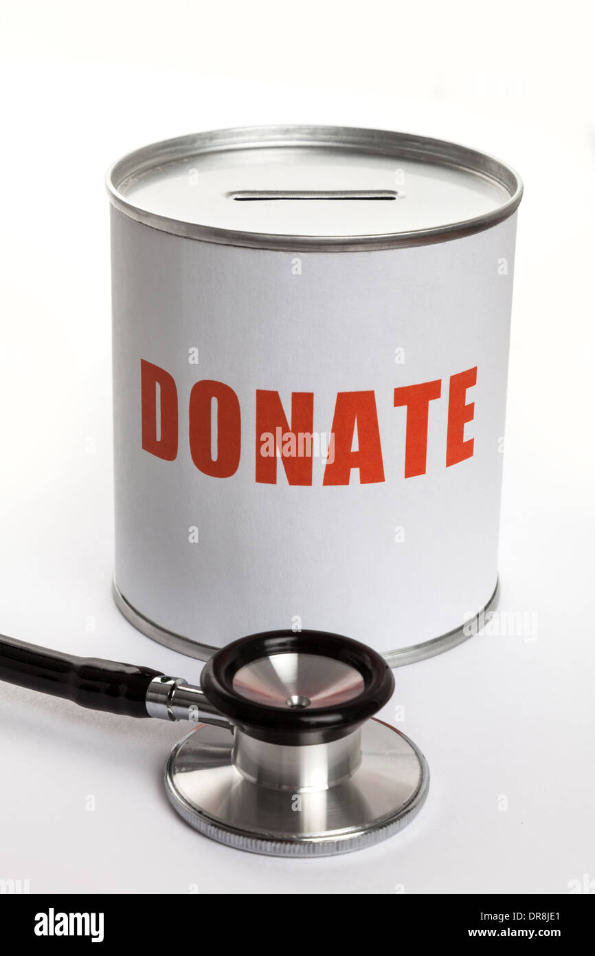 Lo stetoscopio e casella di donazione, il concetto di opera di carità. Foto Stock