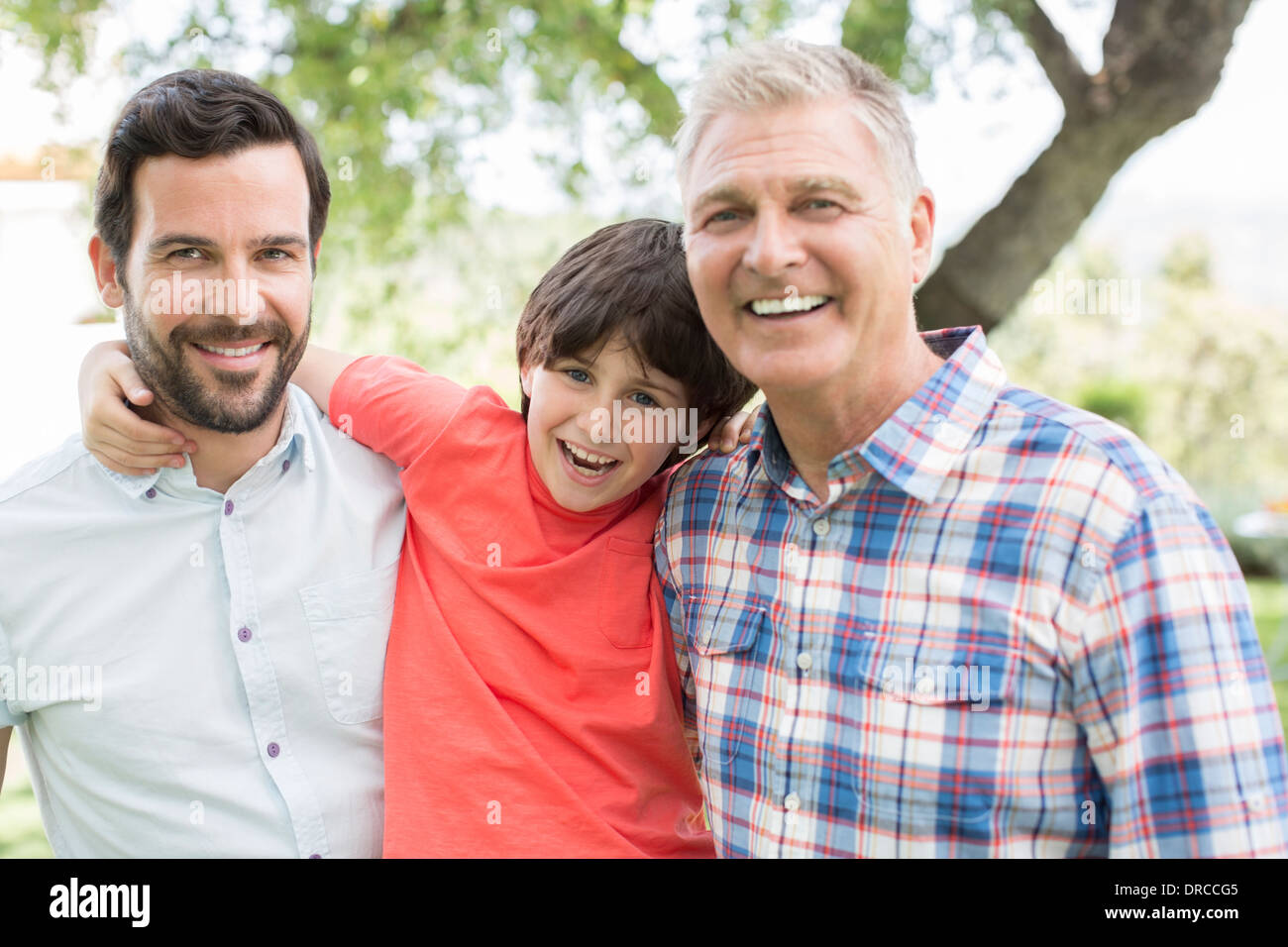 Multi-generazione uomini sorridenti Foto Stock