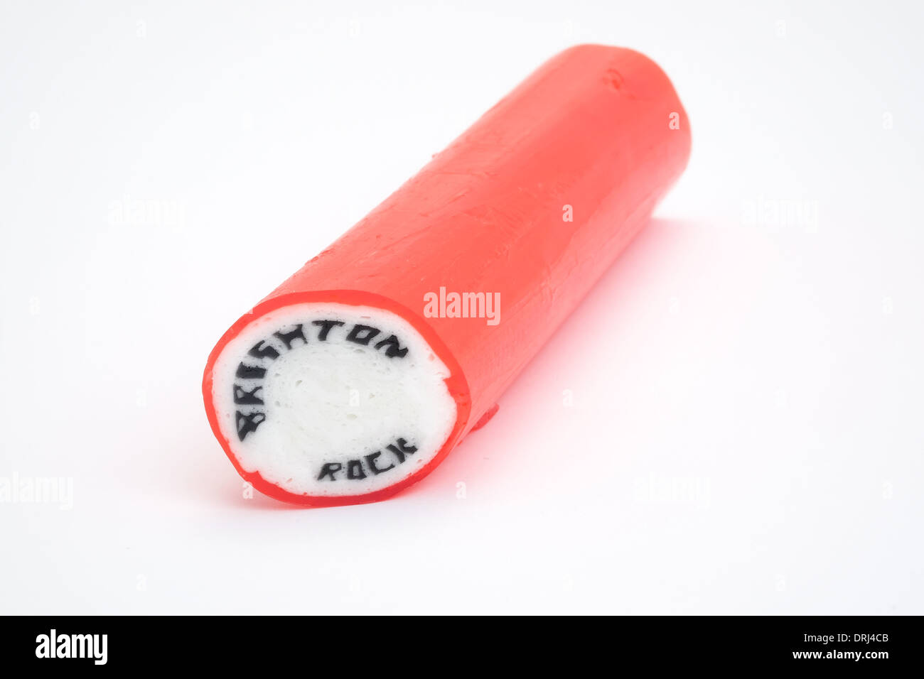 Un bastone di rosa tradizionali rock di Brighton. Le parole di Brighton e Rock passano attraverso tutta la lunghezza della pasticceria dolce. Foto Stock