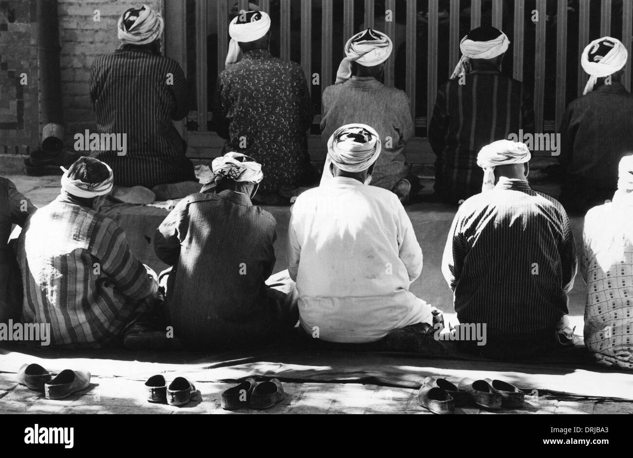 Uzbeki pregando, Samarcanda, Asia centrale Foto Stock