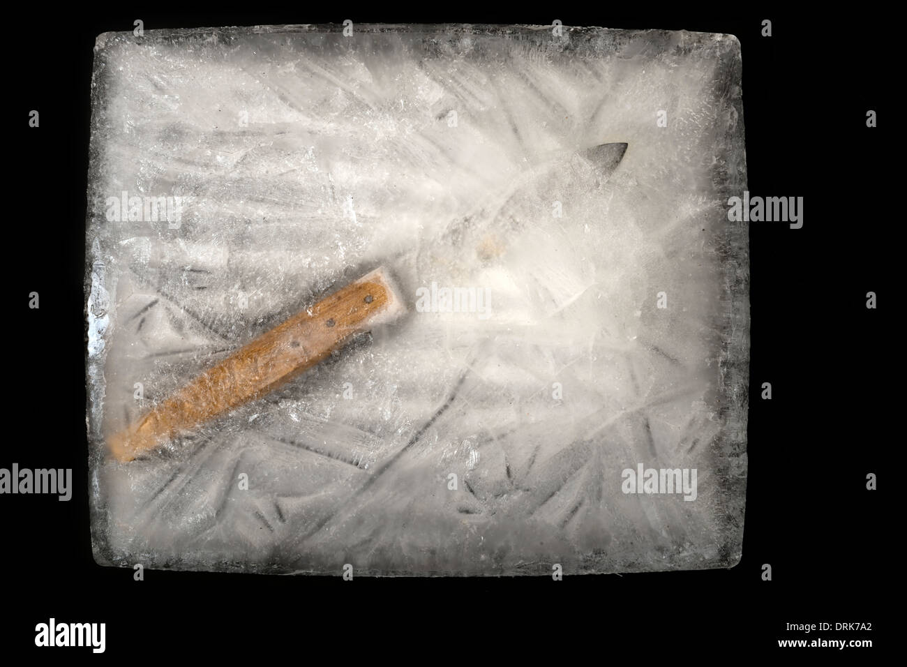 Coltello congelati in blocco di ghiaccio Foto Stock